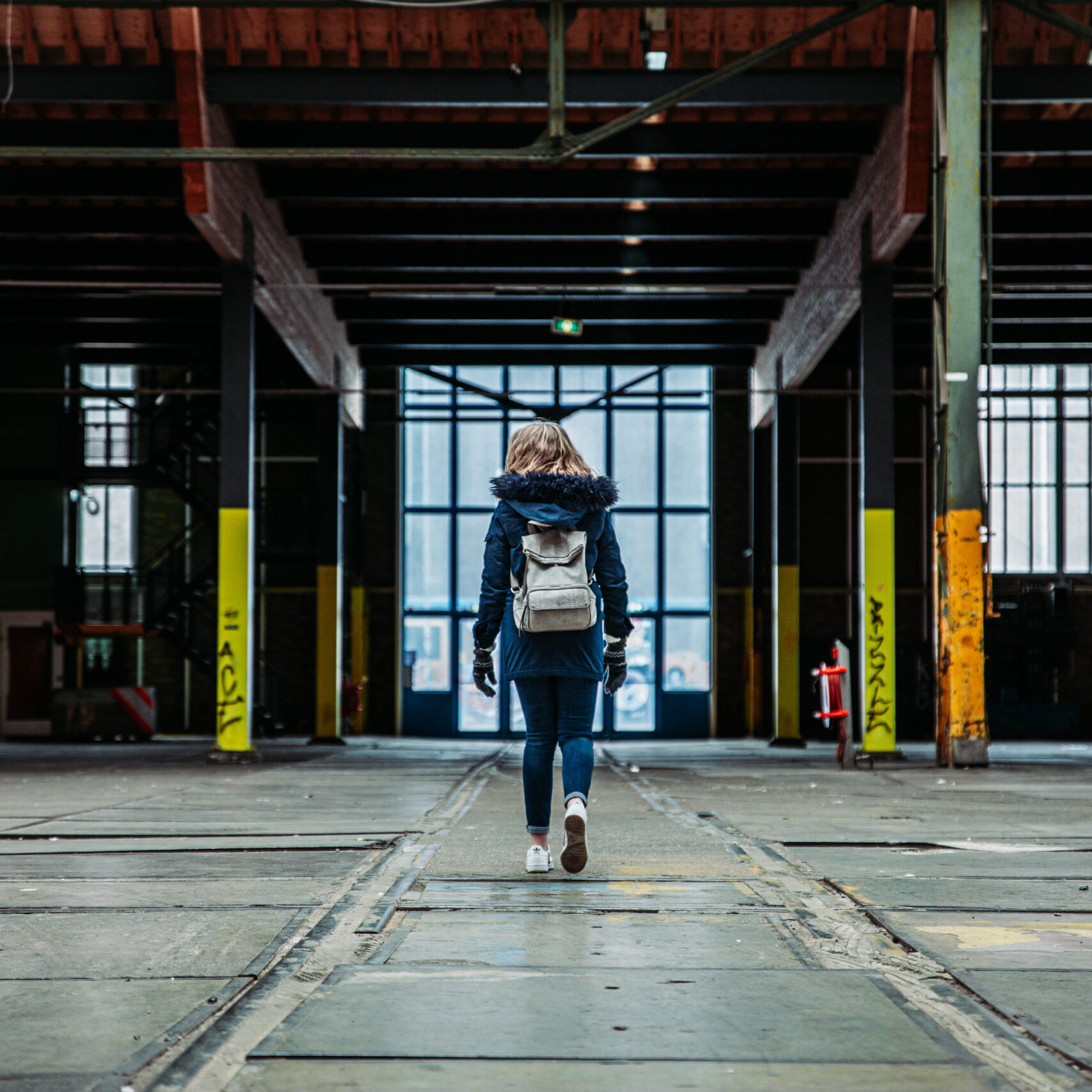 Girl explores Warehouse in Amsterdam